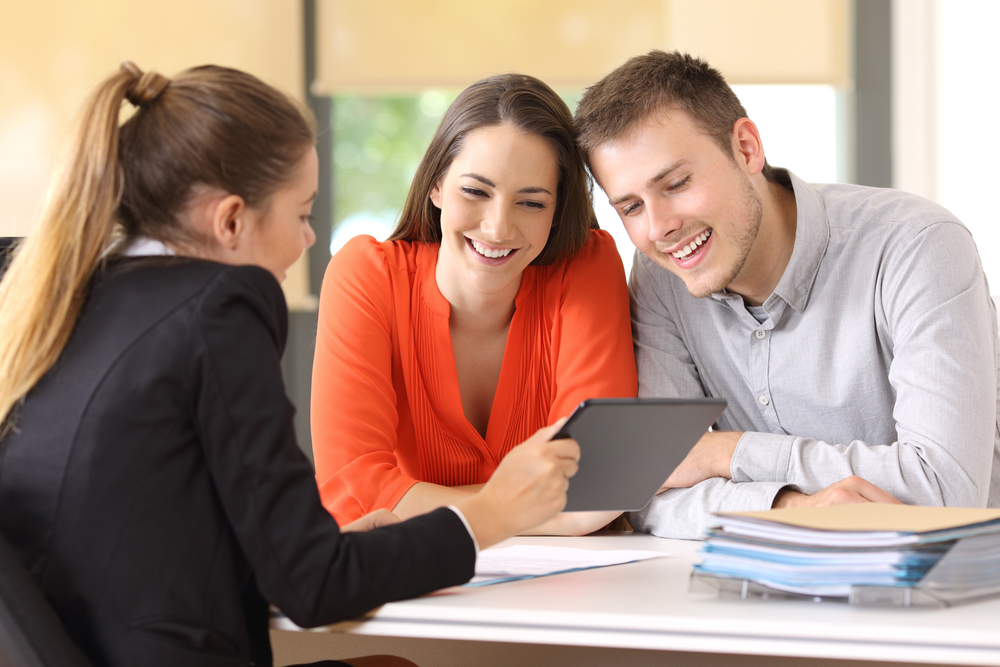 Mortgage broker using Mortgage Maker on a tablet to explain loan options to borrowers